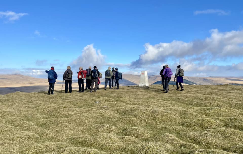 Walkers on a Brecon Beacons Park Society guided walk in Bannau Brycheiniog