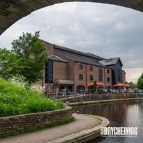 Theatr Brycheiniog and the Monmouthshire & Brecon Canal in Brecon during summer, showcasing one of the town's most popular visitor areas