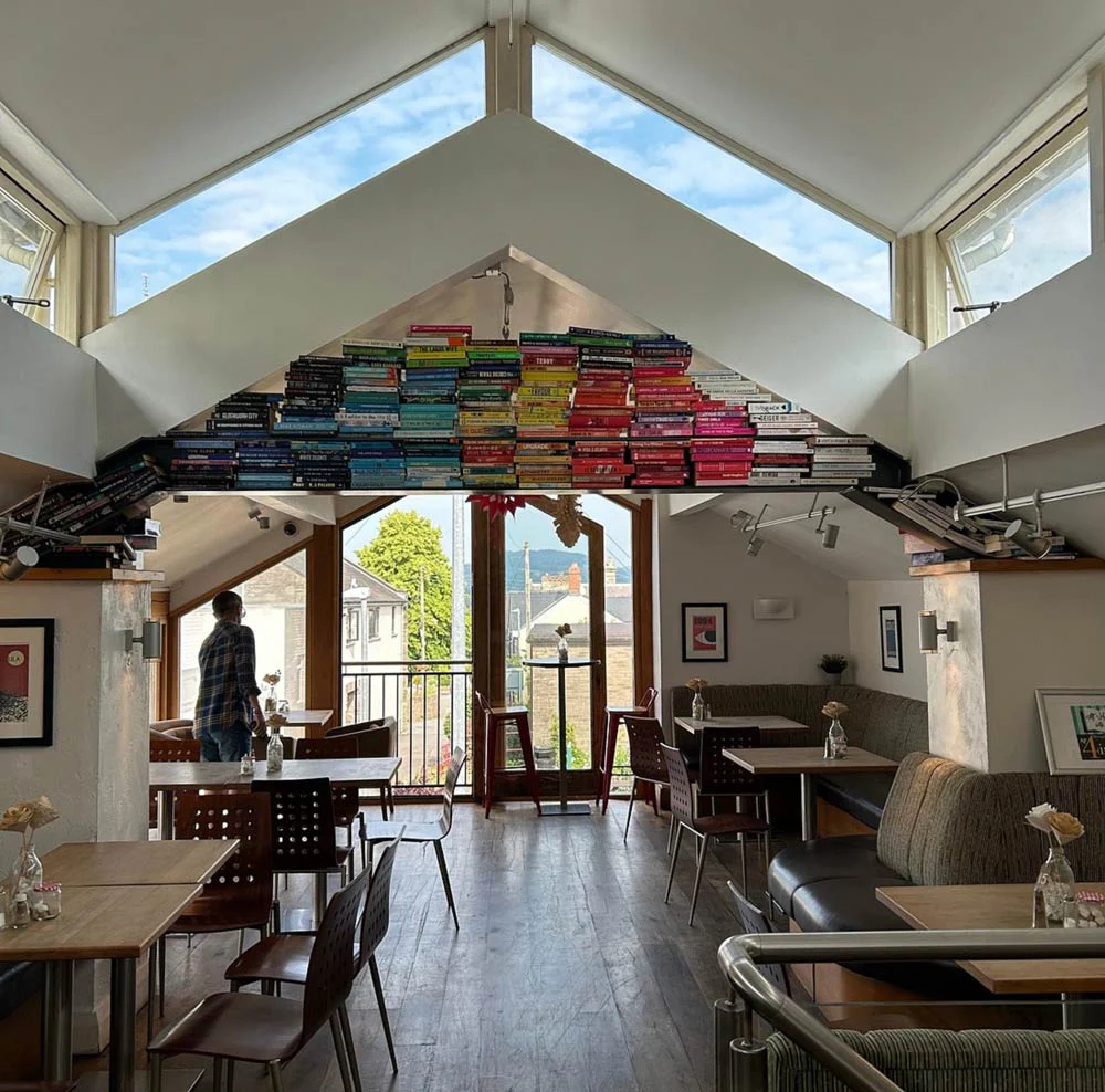 The bright Book-ish Café interior with books and colourful seating