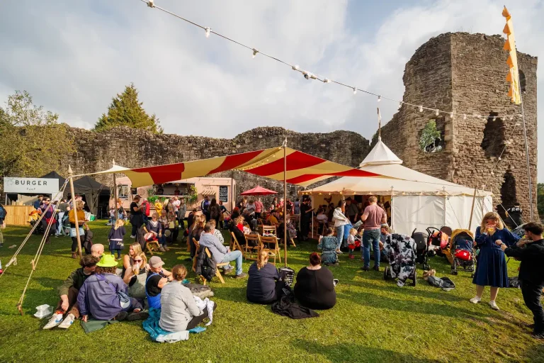 Visitors enjoying Abergavenny Food Festival at Abergavenny Castle