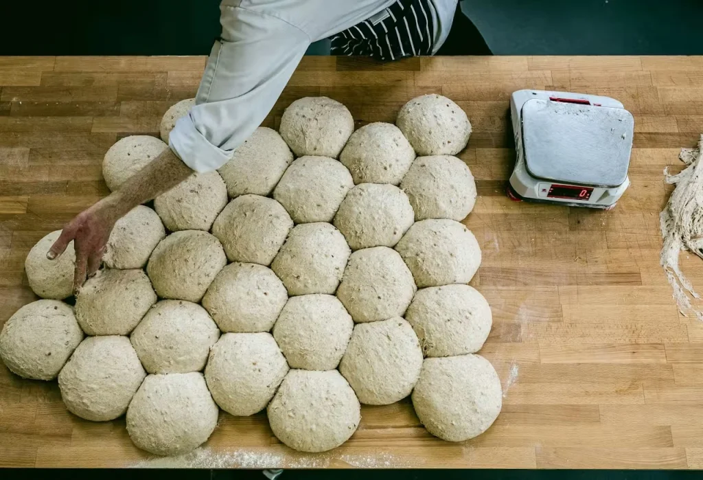 Hand-shaped bread dough ready for baking at The Angel Bakery