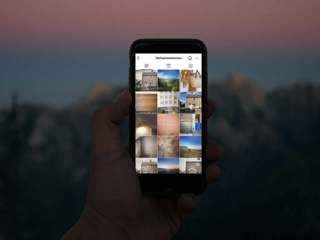 Smartphone displaying a coordinated grid of travel and lifestyle photographs