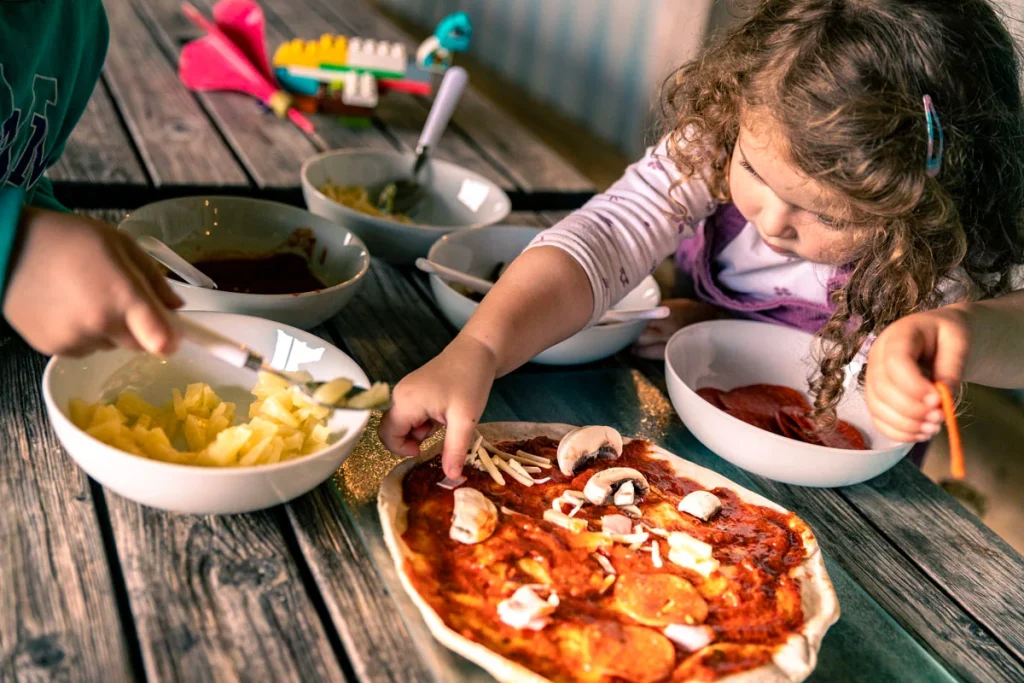 Family sharing food outdoors at Beacons Bluff Escapes