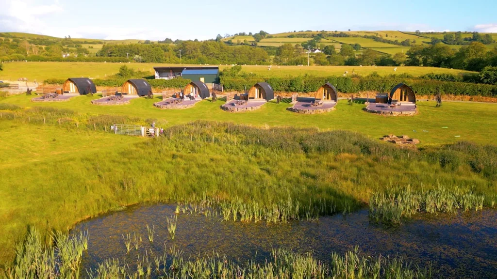 Aerial view of lakeside glamping cabins at Beacons Bluff Escapes