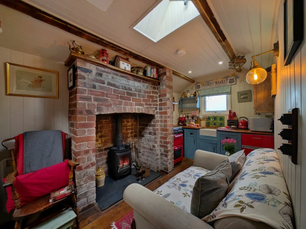 Wood-burner and seating inside Y Golchdy at Black Mountain Escapes