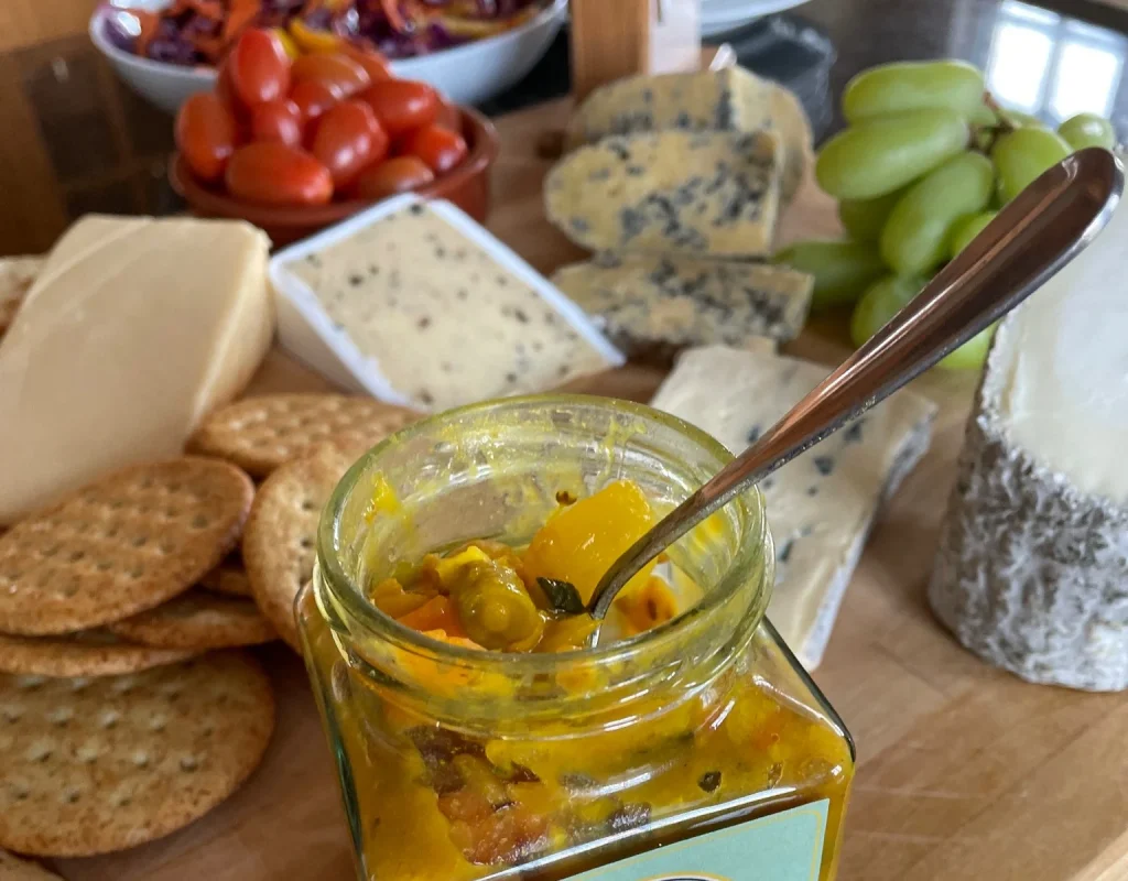A Black Mountains Preserves chutney jar served with Welsh cheese, crackers and fruit
