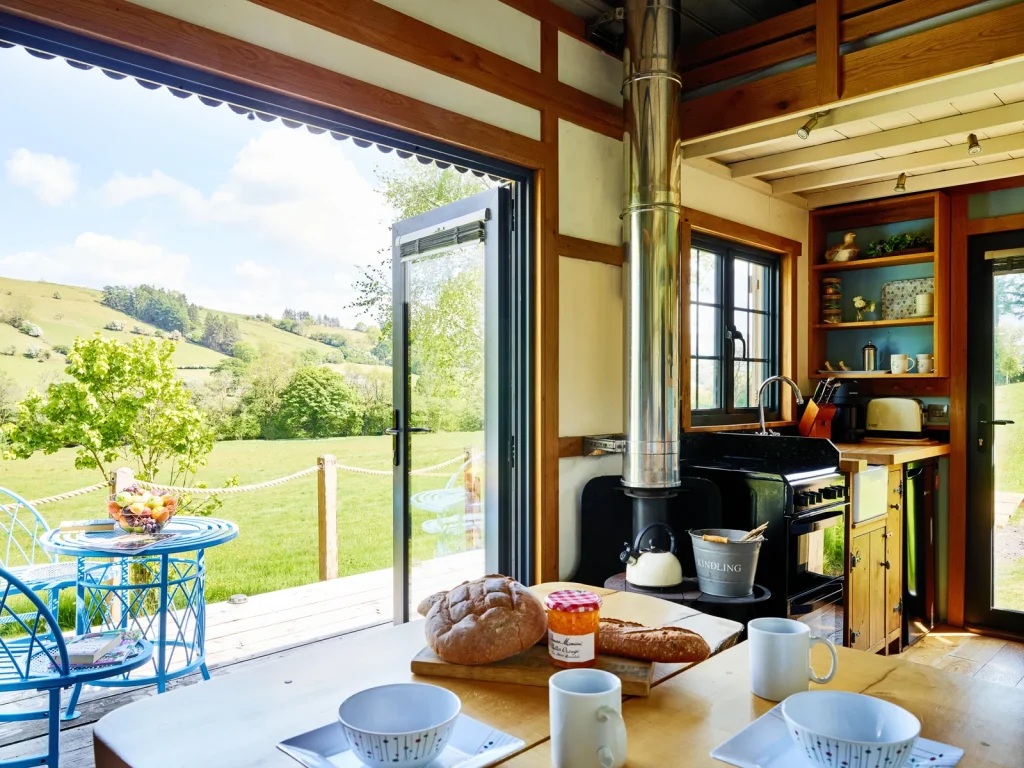 Cosy interior of The Mallard opening to countryside views in the Dark Sky Collection