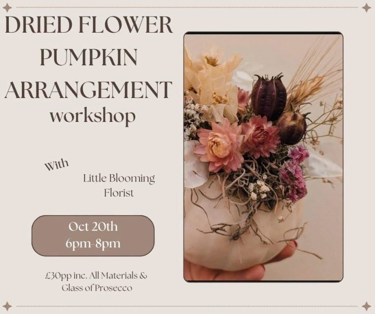 Dried flowers arranged in a pumpkin during a seasonal floristry workshop