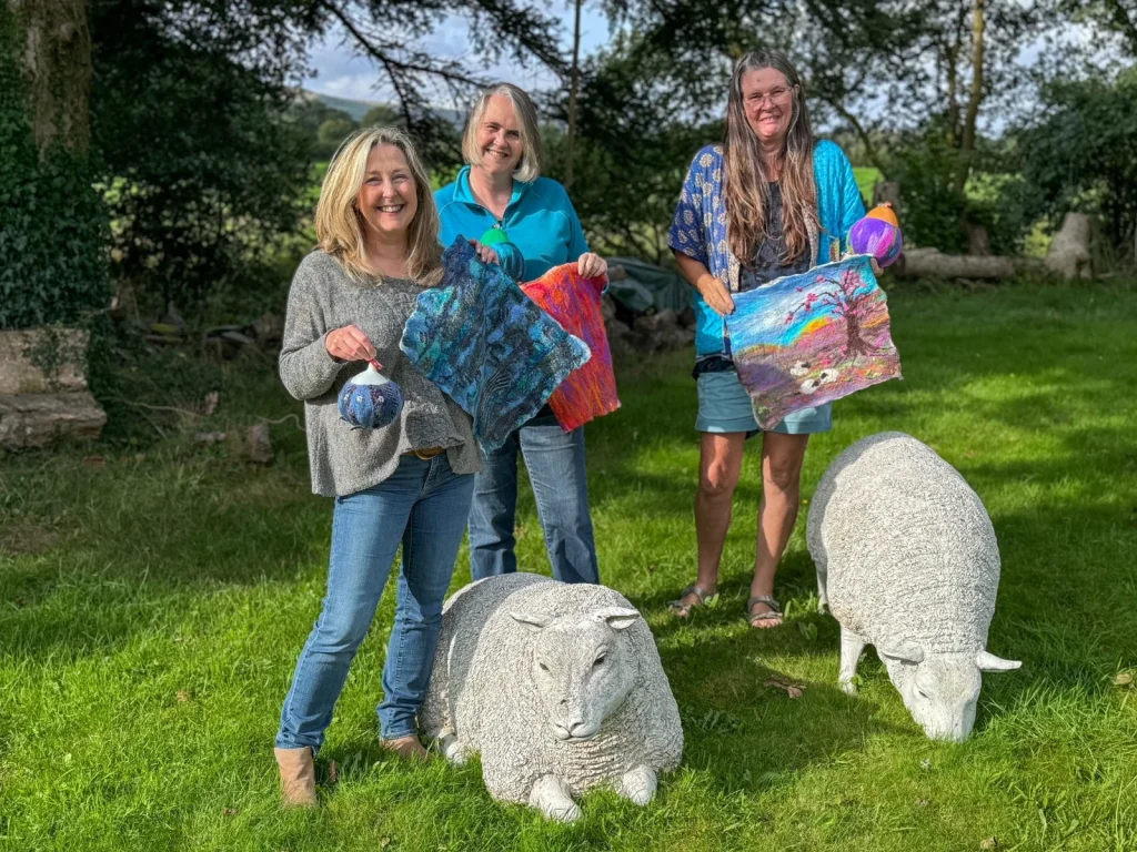 Workshop participants displaying colourful felt sculptures made with Fabulous Feltings