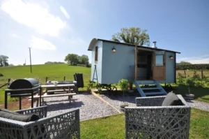 Shepherd hut with outdoor seating in the Holidaycottages.co.uk collection