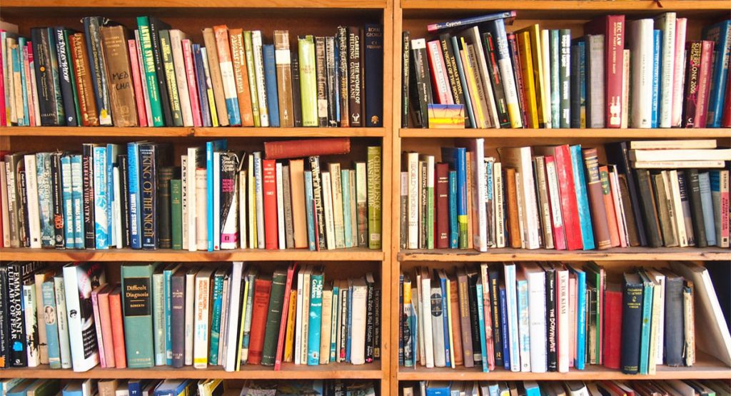 Shelves filled with colourful books at Hay Castle in Hay-on-Wye