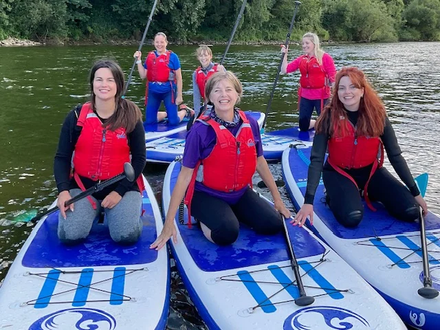 Group learning to paddleboard with Inspire2Adventure