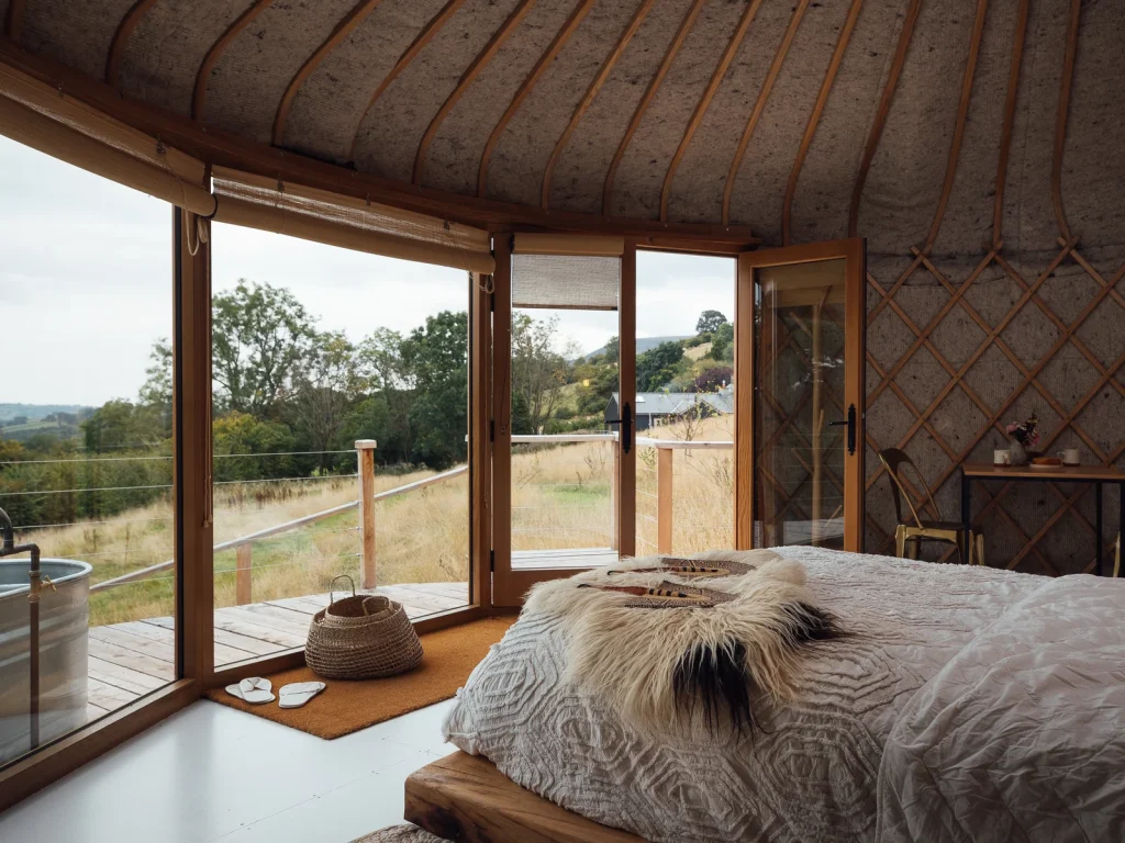 Bedroom inside Pumla with floor-to-ceiling views at Kaya at Blackhill Farm