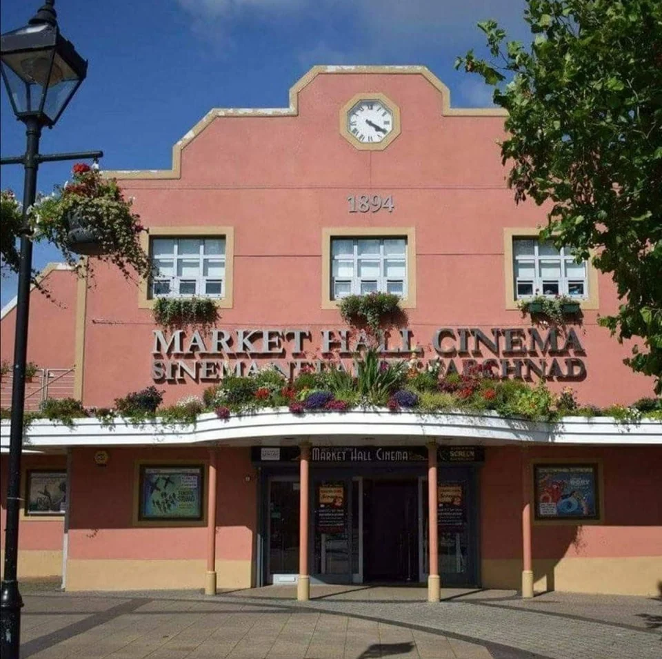 Distinctive red exterior and entrance of Market Hall Cinema in Brynmawr