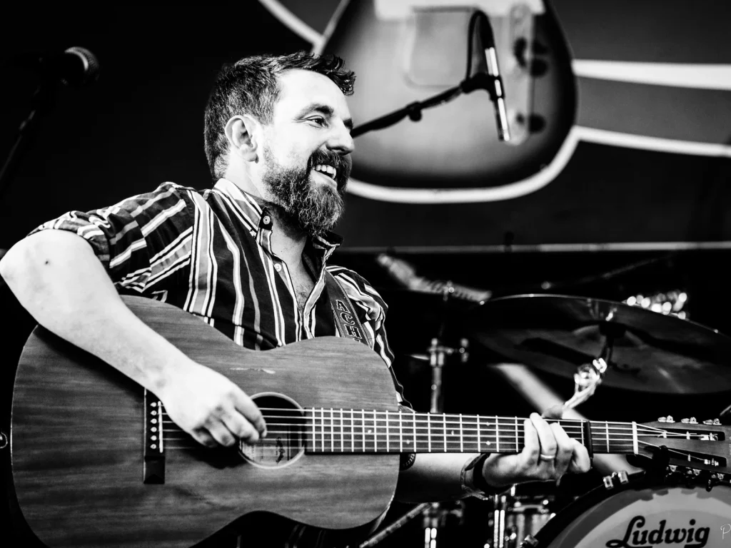 Acoustic guitarist performing for the Mid Wales Rhythm and Blues Club