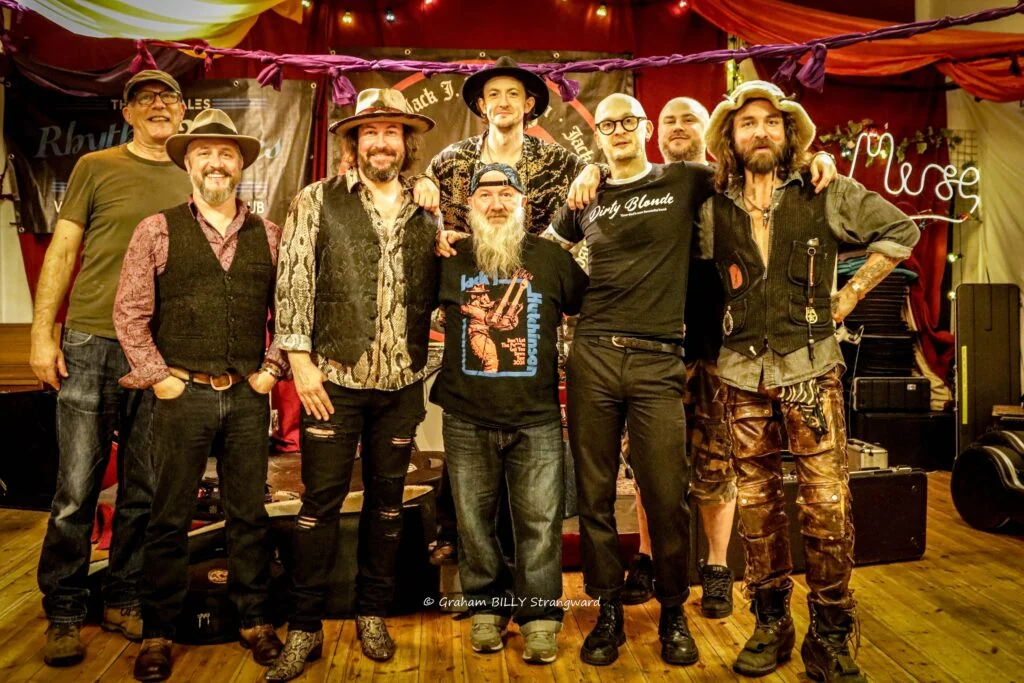 Rhythm and blues band together on stage at a Mid Wales club night