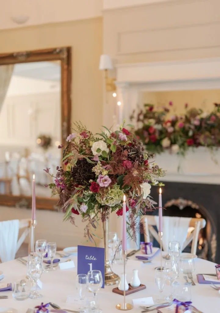 Flower-filled wedding table set at Peterstone Court