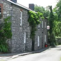Stone exterior of The Red Lion Inn in Penderyn