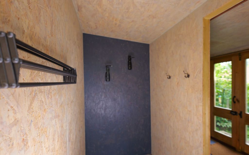 Secure bike storage area inside a cabin at The Roost Merthyr