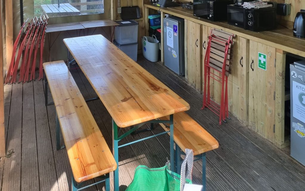 Shared kitchen and dining tables at The Roost Merthyr