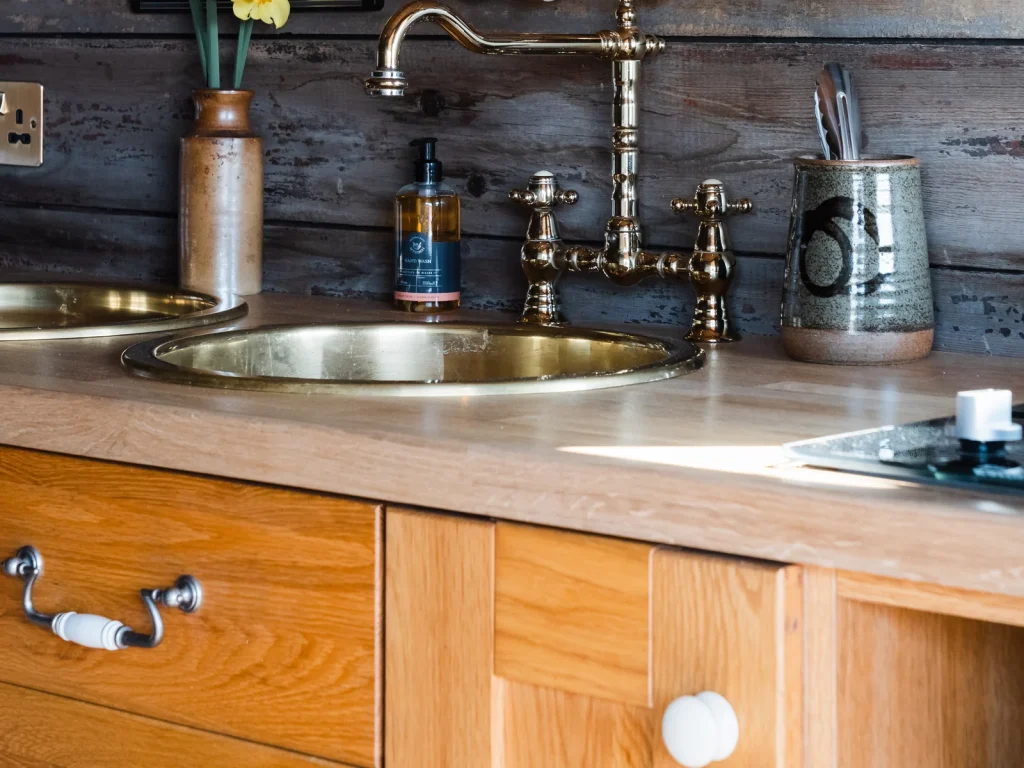 Compact kitchenette inside a Toad and Snail Glamping railway carriage