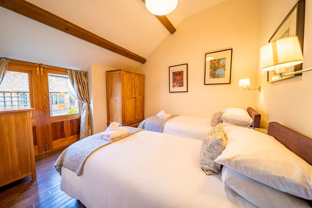 Prepared guest bedroom at Ty Newydd Holidays in the Usk Valley