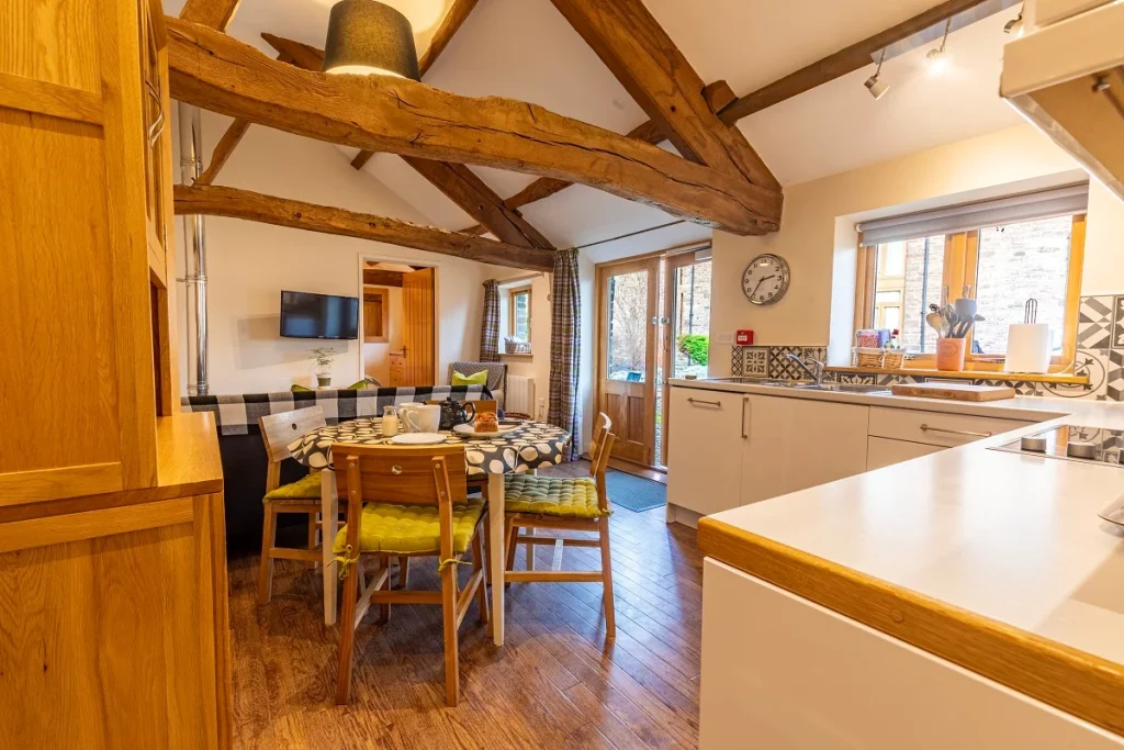 Bright fitted kitchen inside a Ty Newydd Holidays cottage