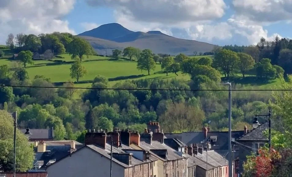 Wide view across Brecon towards the surrounding mountains