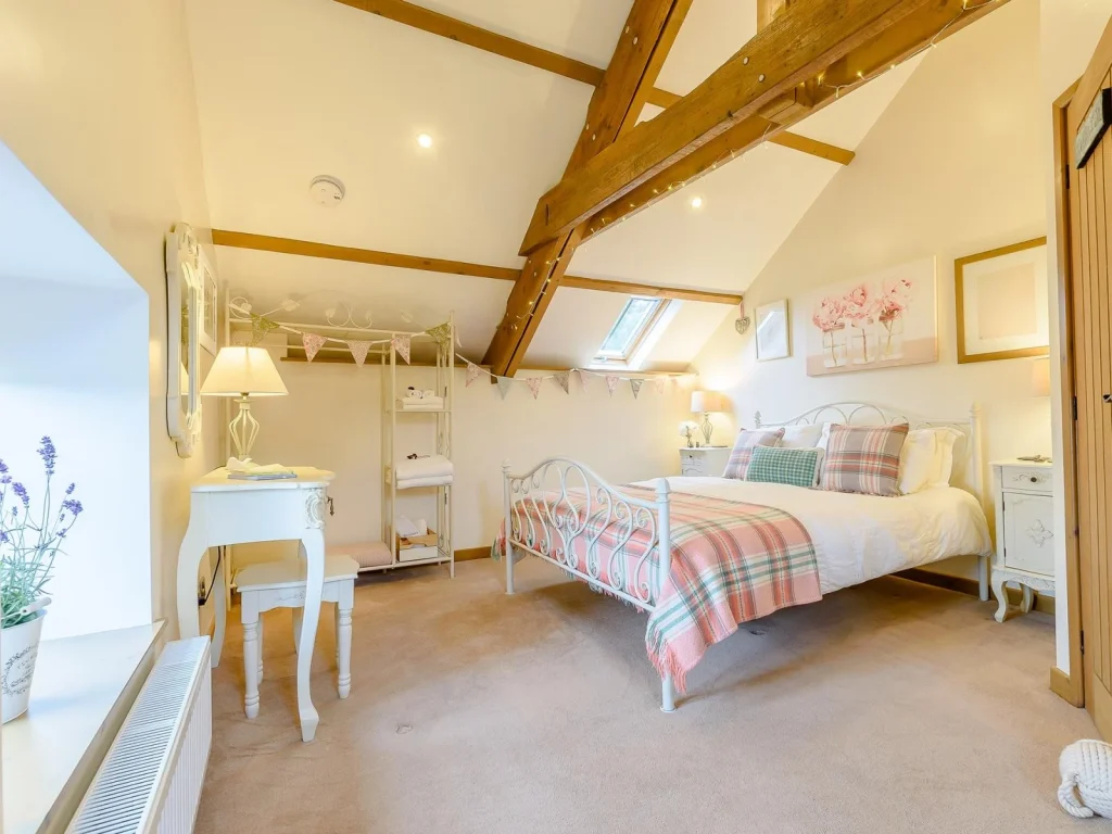 Characterful beamed bedroom from the Wales Cottage Holidays collection