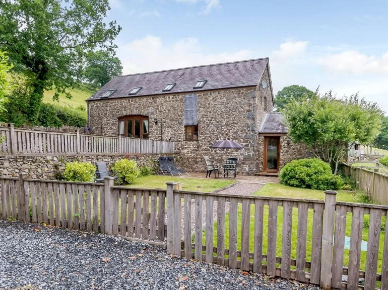 Stone holiday cottage with enclosed garden from Wales Cottage Holidays