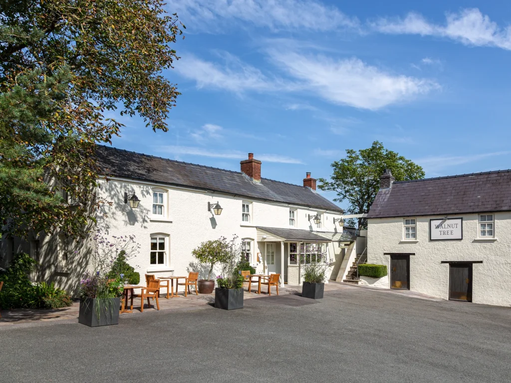 The whitewashed exterior of The Walnut Tree restaurant near Abergavenny