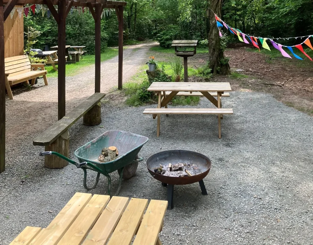 Shared Welcome Cabin and outdoor gathering area at Woodland Park Glamping