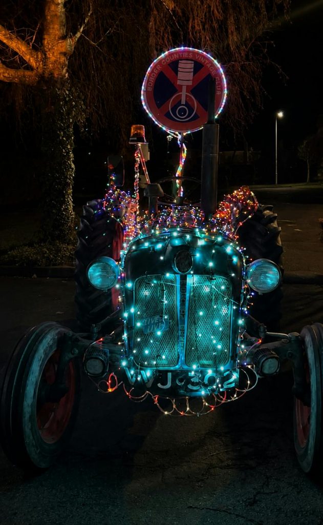 A classic tractor decorated with Christmas lights for Abergavenny Festive Road Run