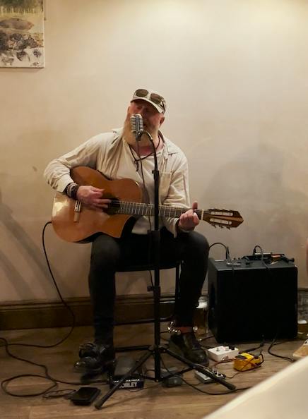 Musician Jim Ramsey performing live